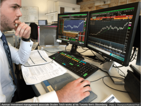 Avenue investment management associate Bryden Teich works at his Toronto firm's Bloomberg terminal